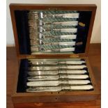 CASED SET OF TWELVE SILVER BANDED AND MOTHER OF PEARL HANDLED FISH KNIVES AND FORKS REASONABLE