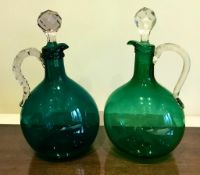 TWO GREEN GLASS DECANTERS