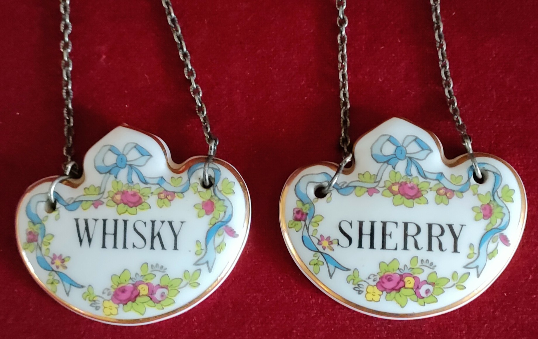 TWO CERAMIC ENAMELLED DRINK'S LABELS REASONABLE, USED CONDITION