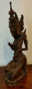 HEAVILY CARVED HARDWOOD FIGURE GROUP DEPICTING AN EASTERN DEITY, APPROXIMATELY 43cm HIGH SOME