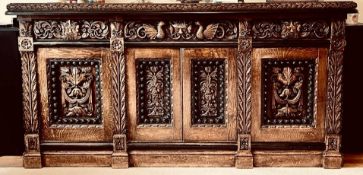 GOOD HEAVILY CARVED OAK SIDEBOARD WITH FOLIATE, SCROLL, MASK AND DRAGON DECORATION, APPROXIMATELY