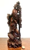 ORIENTAL HARDWOOD CARVING DEPICTING A SAGE WITH CRANE, APPROXIMATELY 31cm HIGH