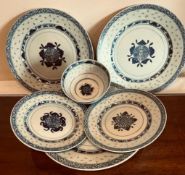 FIVE JAPANESE BLUE AND WHITE PLATES AND BOWL WITH RICE GRAIN DECORATION