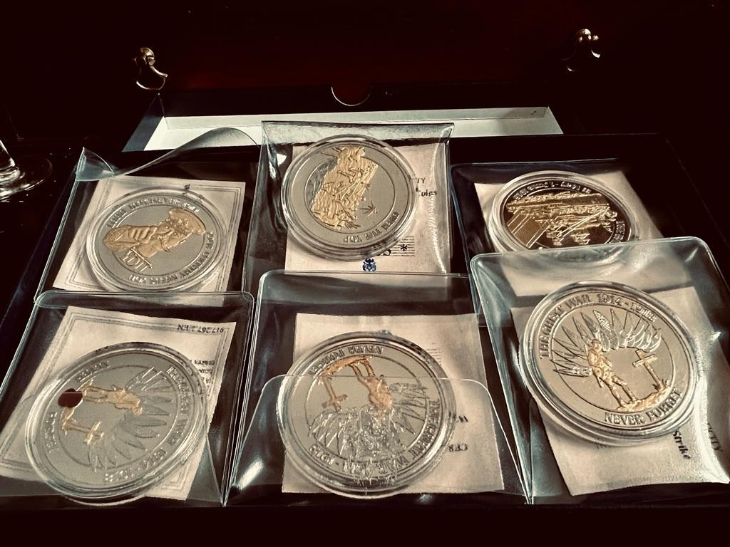 BOX CONTAINING SIX WWI CENTENARY COMMEMORATIVE COINS