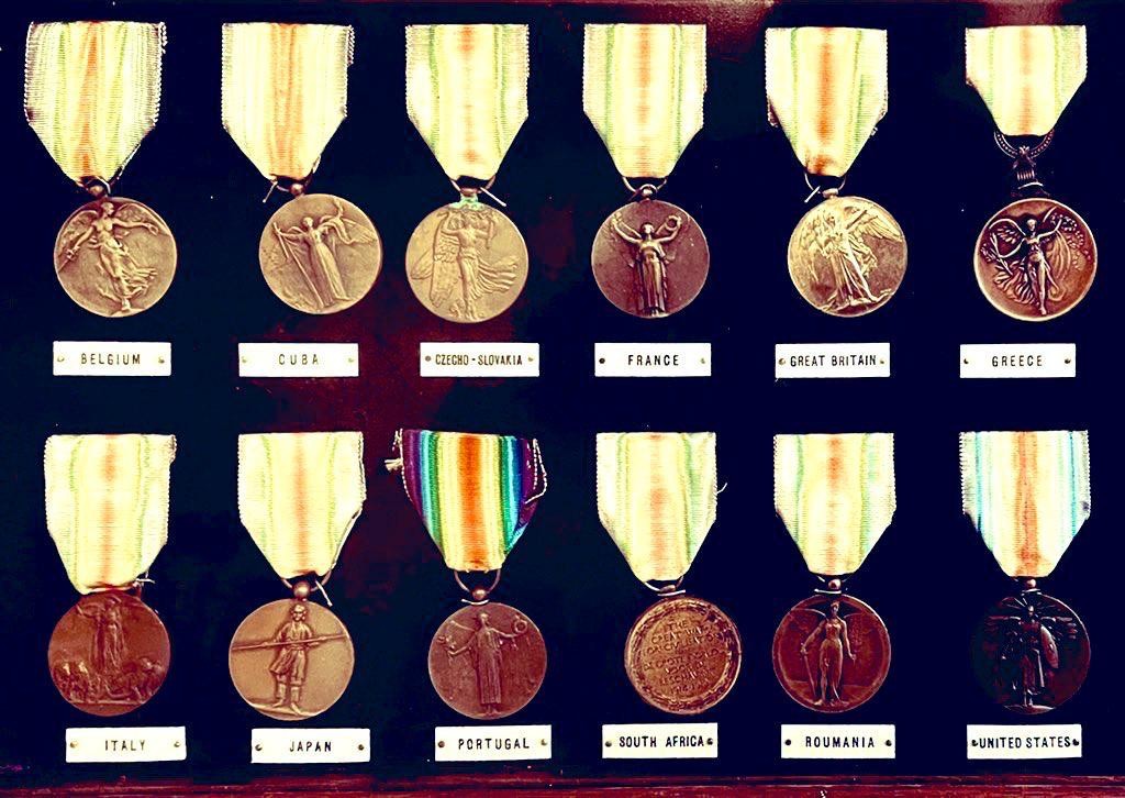 FRAMED COLLECTION OF TWELVE WWI VICTORY MEDALS WITH SOME SCARCE VARIANT INCLUDING SOUTH AFRICA AND