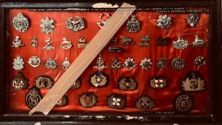 CASE CONTAINING APPROXIMATELY ELEVEN SHIPPING LANE AND THIRTY-TWO WWII BRITISH ARMY CAP BADGES