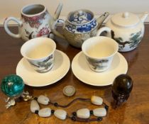 THREE JAPANESE TEAPOTS, TWO TEA BOWLS AND SAUCERS, POLISHED BEADS, MALACHITE SPHERE AND TIGER'S EYE