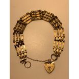 9ct GOLD CHARM BRACELET WITH HEART LOCK, WEIGHT APPROXIMATELY 9.8g
