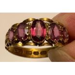 12ct GOLD RING SET WITH FIVE AMETHYSTS, WEIGHT APPROXIMATELY 2.1g