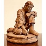 UNGLAZED FIGURE OF A KNEELING CHILD STAMPED NAPLES, APPROXIMATELY 10cm HIGH