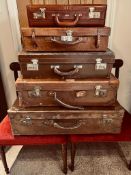 FOUR OLD LEATHER SUITCASES PLUS ANTLER MODERN BRIEFCASE