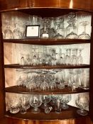 LARGE QUANTITY OF ASSORTED GLASSWARE INCLUDING CUT GLASS, CHAMPAGNE GLASSES AND DECANTER, ETC.