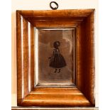 SEMI-SILHOUETTE FULL LENGTH PORTRAIT OF A CHILD, CIRCA 1820, WITHIN WALNUT COLOURED OGEE FRAME,