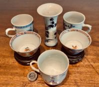 THREE ORIENTAL TEA CUPS AND SMALL VASE PLUS TWO TEA BOWLS, ALL 19th CENTURY