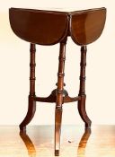 POLISHED MAHOGANY TRI-FORM DROP LEAF TABLE, THE SUPPORTS CONJOINED BY THREE STRETCHERS AND CENTRAL