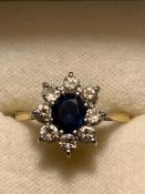 MARKED PLATINUM RING SET WITH BLUE SAPPHIRE APPROX 1.5ct AND EIGHT DIAMONDS APPROX 0.1ct, SIZE P,