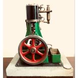 STUART TURNER STATIC MODEL STEAM ENGINE. APPROX. 22CM H X 20.5CM w x 13CM D (INCLUDING BASE) USED