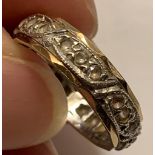 UNMARKED YELLOW AND WHITE METAL RING BAND WITH SMALL WHITE SPINELS, SIZE N+, WEIGHT APPROXIMATELY