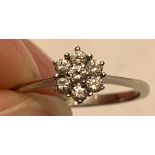 21ct WHITE GOLD RING WITH A CLUSTER OF SEVEN 0.07 DIAMONDS, SIZE M, WEIGHT APPROXIMATELY 2g