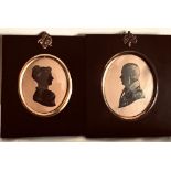 TWO SILHOUETTE PORTRAITS WITHIN FRAMES