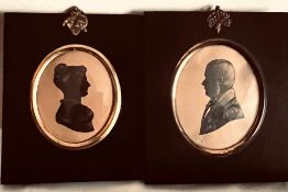 TWO SILHOUETTE PORTRAITS WITHIN FRAMES