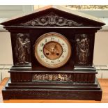 SLATE MANTLE CLOCK WITH CAST METAL PANELS IN THE CLASSICAL MANNER