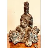 BRONZE PATINATED FIGURE DEPICTING KWAN YIN SEATED, APPROXIMATELY 29cm HIGH