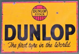 Dunlop Stock enamel advertising sign. Approx. 51 x 76cm Used condition, wear to enamel