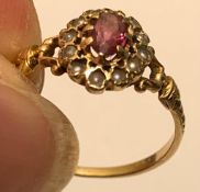 UNMARKED YELLOW METAL RING WITH AMETHYST AND TWELVE PEARLS, WEIGHT APPROXIMATELY 1.9g, SIZE L