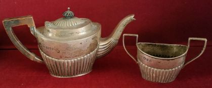 TWO PIECE HALLMARKED SILVER TEASET COMPRISING OF TEAPOT AND TWO HANDLED SUGAR BOWL, CHESTER ASSAY