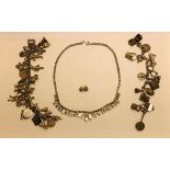 STERLING SILVER CHARM BRACELET WITH THIRTY STERLING SILVER CHARMS APPROX 85g, CHARM BRACELET WITH