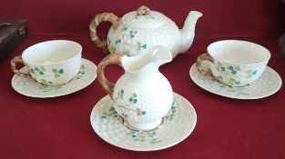 SEVEN PIECES OF EARLY 20TH CENTURY BELLEEK SHAMROCK TEAWARE, WITH BLACK MARKS TO BASE. SLIGHT