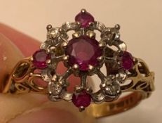 18ct GOLD RING WITH APPROX ONE 0.5ct AND FOUR 0.7ct RUBY AND FOUR 0.3ct DIAMONDS, WEIGHT