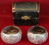 CASED PAIR OF HALLMARKED SILVER REPOUSSE DECORATED NAPKIN RINGS, BIRMINGHAM ASSAY DATED 1904 BY