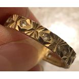 9ct GOLD BAND RING WITH NINE SMALL SPINELS, WEIGHT APPROXIMATELY 2.5g, SIZE Q ONE STONE MISSING