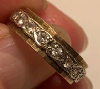 9ct GOLD BAND RING WITH THIRTY-FIVE WHITE SMALL SPINELS, TOTAL WEIGHT APPROXIMATELY 3.7g, SIZE K ONE