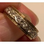 9ct GOLD BAND RING WITH THIRTY-FIVE WHITE SMALL SPINELS, TOTAL WEIGHT APPROXIMATELY 3.7g, SIZE K ONE