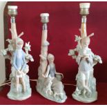 THREE VARIOUS GLAZED CERAMIC LLADRO TABLE LAMPS, DECORATED WITH FIGURES AND FOLIAGE ALL IN USED