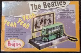The Beatles Bus Telephone novelty phone in the shape of a Route-master bus complete with box. The