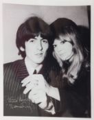 Black and white photograph of George Harrison and Pattie Boyd signed by Pattie Boyd