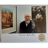 Peter Blake signed photograph of him with various Sgt Pepper images