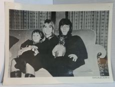 Four approx A4 size photographs of The Beatles with wives, girlfriends and children from The Beatles
