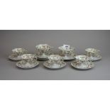 A group of fine Limoges porcelain cups and saucers.