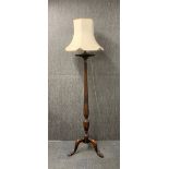 An impressive carved mahogany torcher style standard lamp, H. 198cm (with shade).