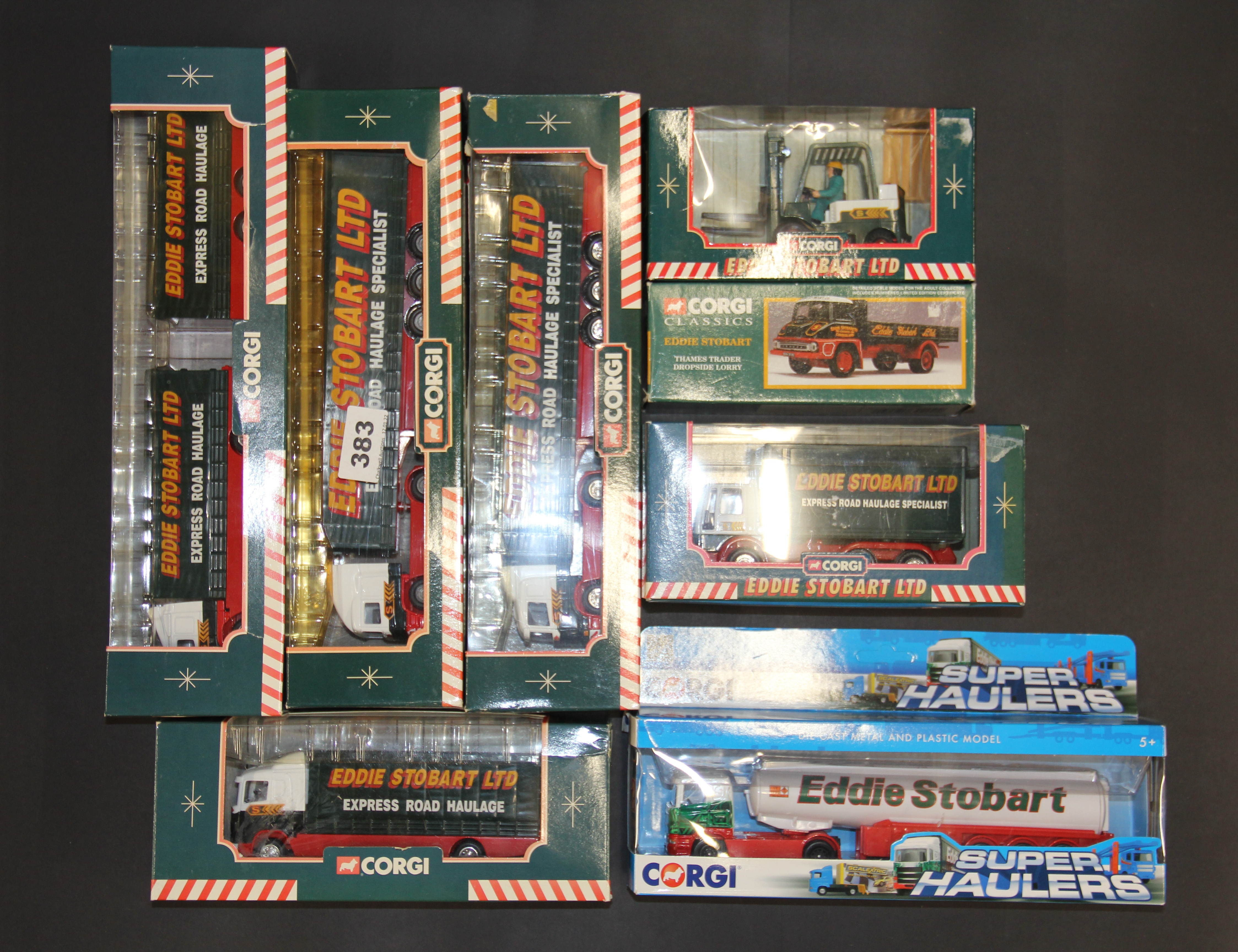 A group of Corgi die cast Eddie Stobart vehicles.