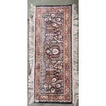 An Eastern silk rug, 46 x 118cm.