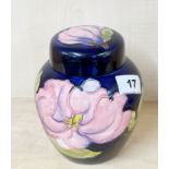 A Moorcroft hibiscus pattern jar and lid, H. 16cm.