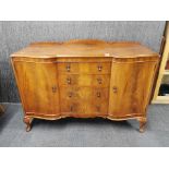 A flame mahogany veneered sideboard, H. 93cm, W. 136cm.