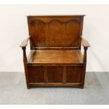 A 1930's oak monks bench, 91 x 103cm.