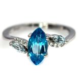 A 925 silver ring set with marquise cut London blue topaz and white stones, (L.5).